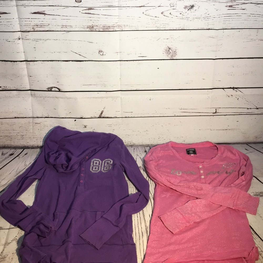 I’m selling 2 medium pink and purple shirts